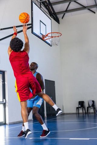 Dynamic Basketball Game with Focused Athletes in Action
