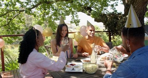 Diverse group enjoying outdoor garden party celebration