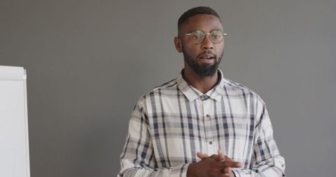 Confident Business Presentation by Professional in Glasses