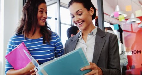Female Colleagues Collaborating in Modern Office - Download Free Stock Images Pikwizard.com