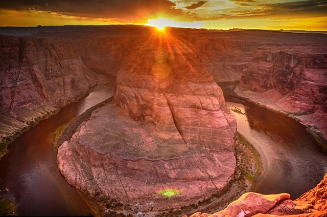 Photograph showing the iconic Horseshoe Bend during a vibrant sunset in Grand Canyon National Park, Arizona. Ideal for travel websites, tourism promotions, nature calendars, outdoor adventure brochures, geological tours, and educational material.