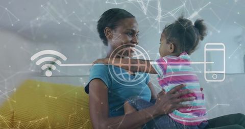 Mother cradling daughter on couch with network overlay showing wifi and mobile connection