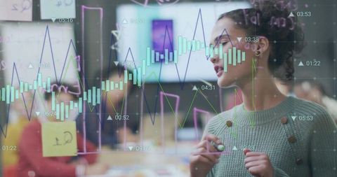 Young Woman Discussing Data Trends on Office Glass Board