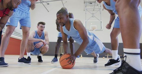 Basketball Players Training Inside Indoor Gym
