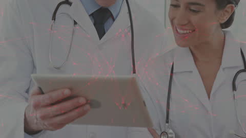 Medical Professionals Analyzing Digital Data with Tablet
