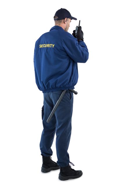 Security officer wearing blue uniform and black cap, using walkie-talkie for communication. Ideal for illustrating security services, law enforcement, and safety measures. Useful for websites related to protective services, training materials, or safety equipment.