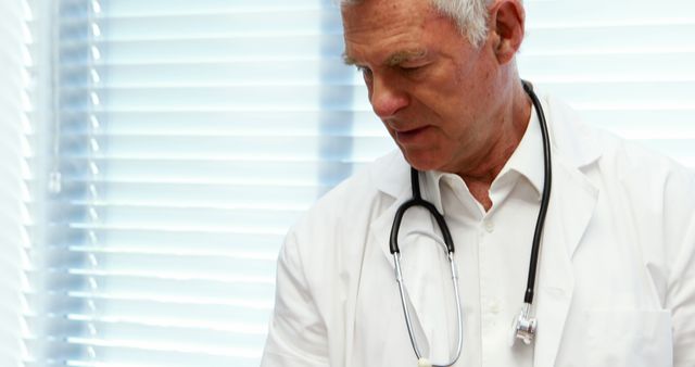 Senior Doctor in White Lab Coat with Stethoscope Consulting Patient - Download Free Stock Images Pikwizard.com