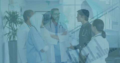 Medical Team Discussing Financial Strategies with Technology Overlay