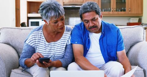 Couple Planning Finances Together at Home