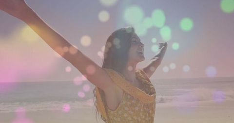 Carefree Woman Embracing Sunshine at Tranquil Beach