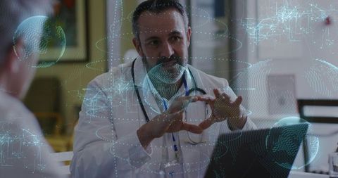 Male Doctor Making Heart Gesture During Telemedicine Consultation with Holographic Data