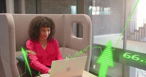 Professional Woman Analyzing Financial Data in Modern Office