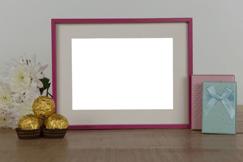transparent photo frame with flowers, chocolates, and gift boxes on table - Download Free Stock Videos Pikwizard.com