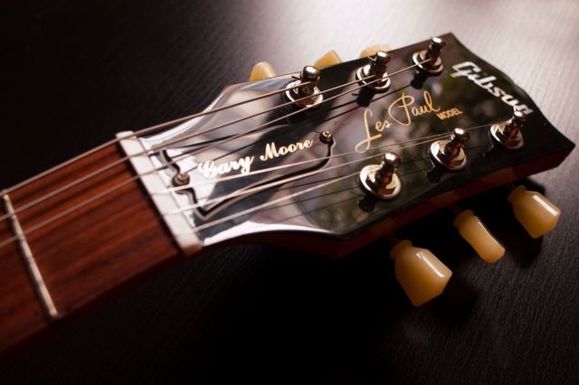 Close up view of a electric guitar headstock. Music concept