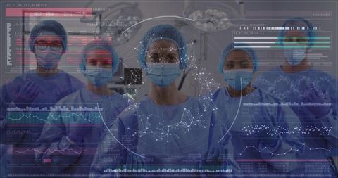 Healthcare professionals and technology interface in modern surgery