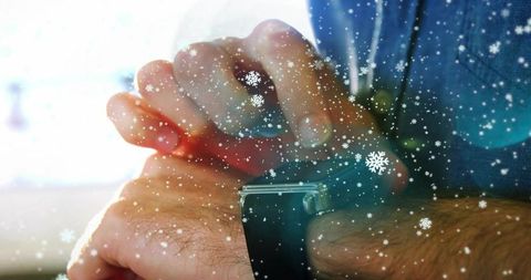 Snowflake-adorned smartwatch glowing winter connection