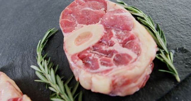 Raw Veal Osso Buco on Slate with Rosemary Garnish - Download Free Stock Images Pikwizard.com