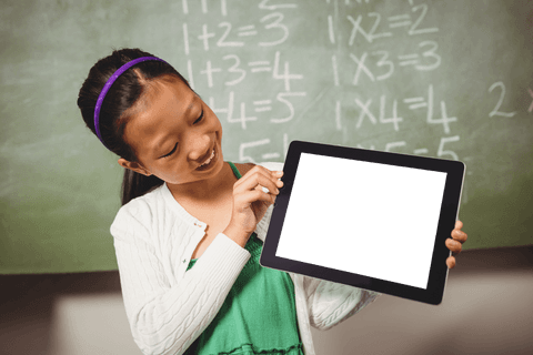 smiling schoolgirl displaying blank digital tablet in classroom - Download Free Stock Videos Pikwizard.com
