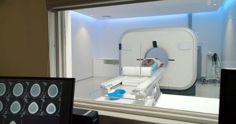 African american man undergoing ct scan in modern radiology lab for diagnosis