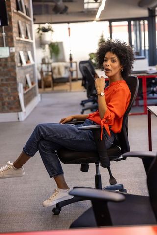 Creative Professional Woman in Contemporary Open-Plan Office Space