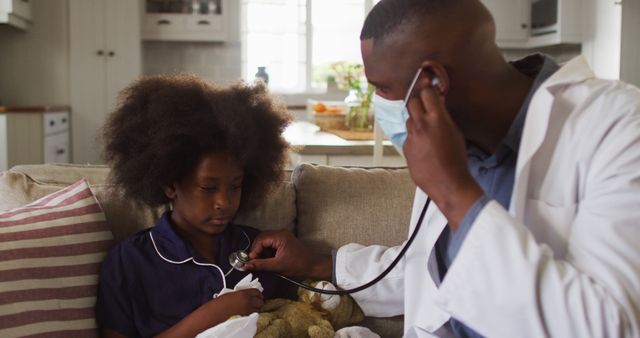 Doctor is examining a sick child with a stethoscope at home during a house call. Can be used in healthcare advertisements, child welfare campaigns, articles about house call services, and pediatric care promotions.
