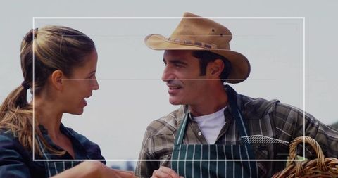 Rustic communication between coworkers in aprons discussing work