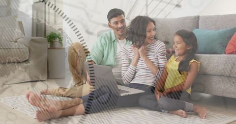 Family relaxing on living room rug using laptop with clock and time concept overlay