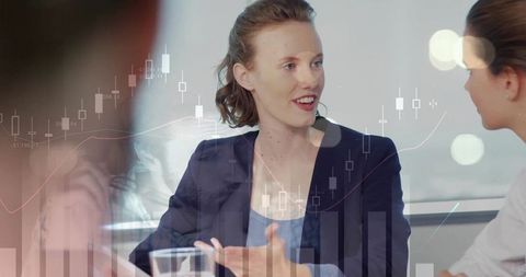 Business Woman in Meeting with Financial Graph Overlay