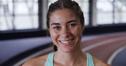 Fit Young Woman Smiling in Indoor Gym Tropical Sports top JumpSuit - Download Free Stock Images Pikwizard.com