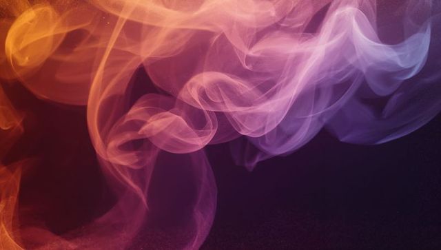 Swirling orange to purple smoke drifting over dark backdrop, ethereal multicolor vapor