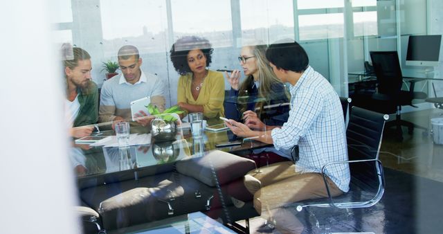 Diverse Business Team Collaborating in Modern Office, Discussing Ideas Around Glass Table - Download Free Stock Images Pikwizard.com