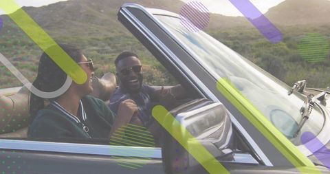 Driving Convertible Couple Laughing on Scenic Countryside Road with Graphic Overlays