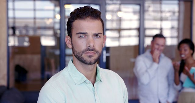 Confident Young Man Standing in Office Environment - Download Free Stock Images Pikwizard.com