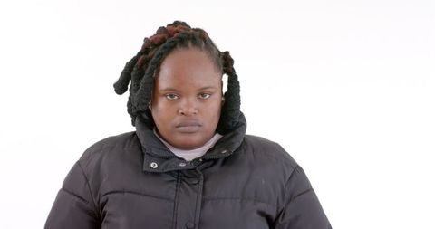 Confident african woman smiling in winter fashion