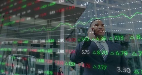 Businessman Talking on Phone Outside Glass Office with Stock Market Data Overlay