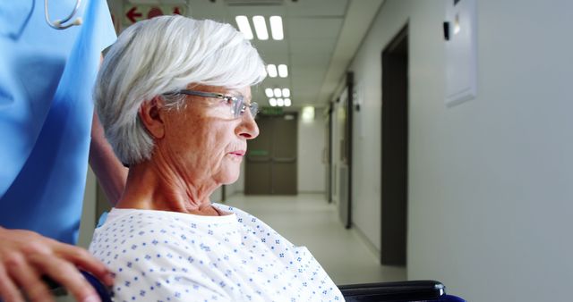 Nurse Taking Care of Elderly Patient in Modern Hospital Corridor - Download Free Stock Images Pikwizard.com