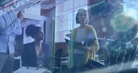 Professional Team Discussing Collaboration Strategies in Modern Office