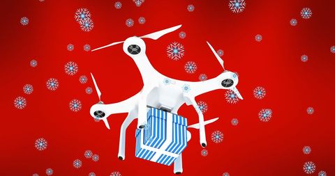 Drone delivering holiday gift amidst snowflakes on red background