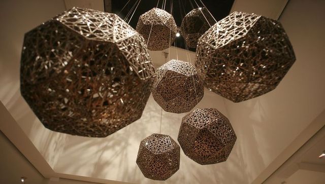 Modern geometric lattice sculptures hanging from ceiling