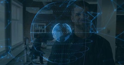 Bearded man gesturing and interacting with holographic digital globe in modern workspace