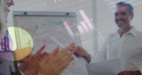 Senior Professional Presenting Business Data Analysis at Office