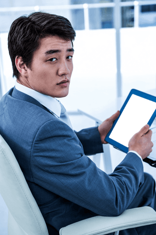 Businessman Posing with a Transparent Tablet in Office Setting - Download Free Stock Videos Pikwizard.com
