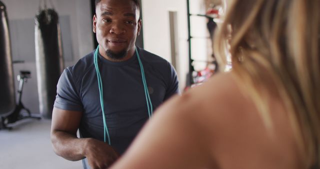 Personal Trainer Helping Client at Gym During Workout Session - Download Free Stock Images Pikwizard.com