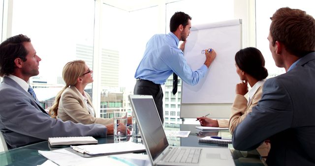 Professional Business Team in Office Meeting with Flip Chart - Download Free Stock Images Pikwizard.com