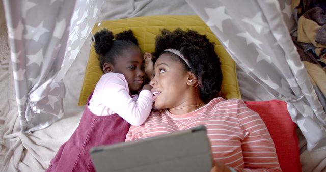 Mother and Daughter Bonding with Digital Tablet in Play Fort - Download Free Stock Images Pikwizard.com