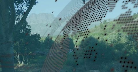 Curved globe perforations overlooking tranquil mountain valley