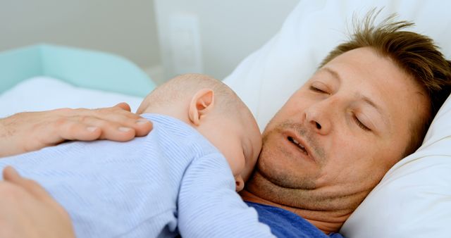 Father Napping with Baby on His Chest in Bed - Download Free Stock Images Pikwizard.com