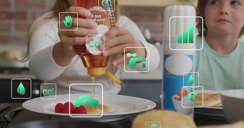 Child pouring syrup onto pancake with smart nutrition and sustainability data overlay