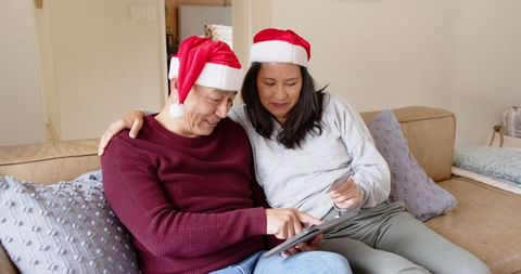 Senior father daughter bonding christmas season bespoke technology