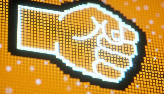 Pixel-art fist on led panel with neon orange halo and cyan glow macro pixel grid